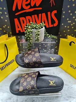 BROWN LOUIS VUITTON SLIDERS £30